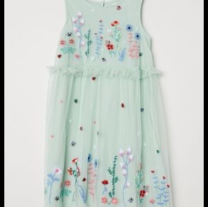 An mint green floral mesh children's dress